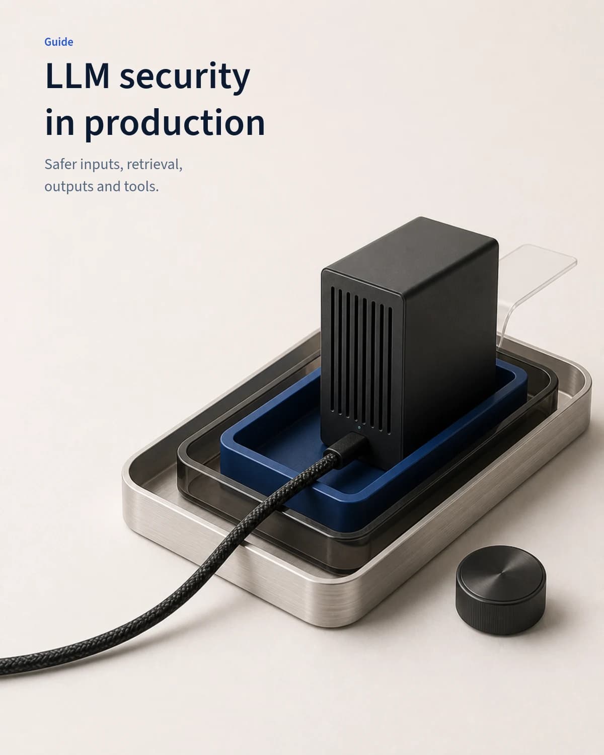 A compact production model server stands inside nested cobalt, smoked-glass and aluminium control trays